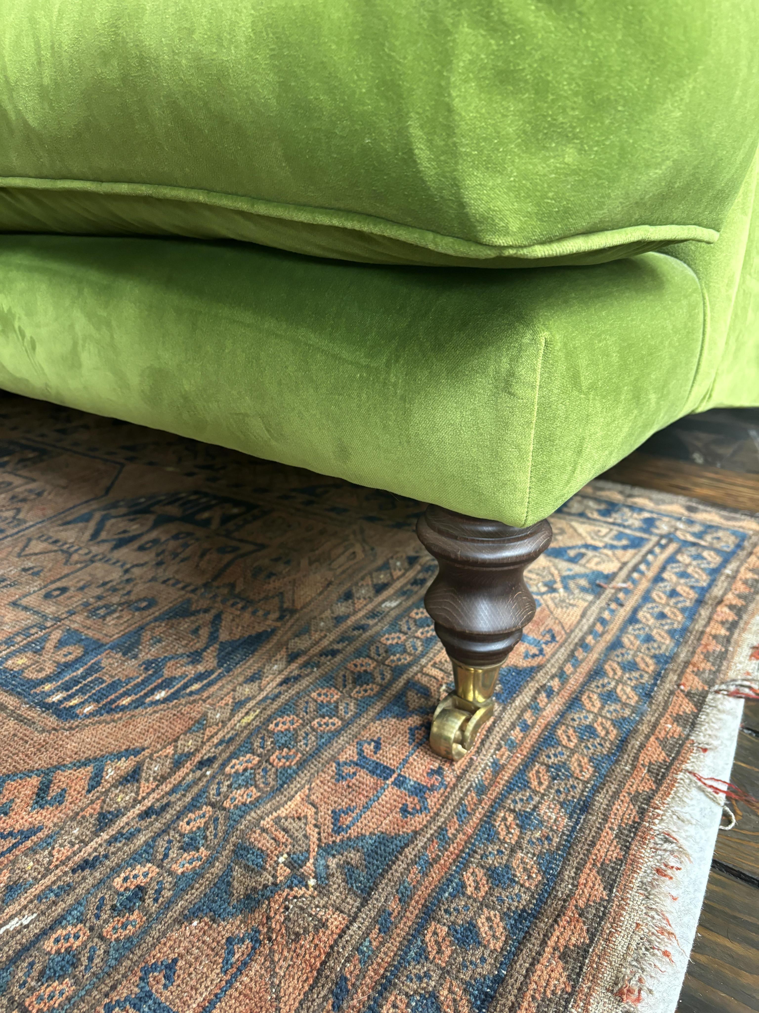 A Sofa Workshop 'Lady May' English roll arm green velvet four seater settee, Howard style sofa, seating generously feather filled, width 200cm, depth 110cm, height 84cm seat height 48cm. Condition - very good